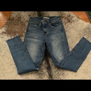 Levi high rise skinny with ripped knees